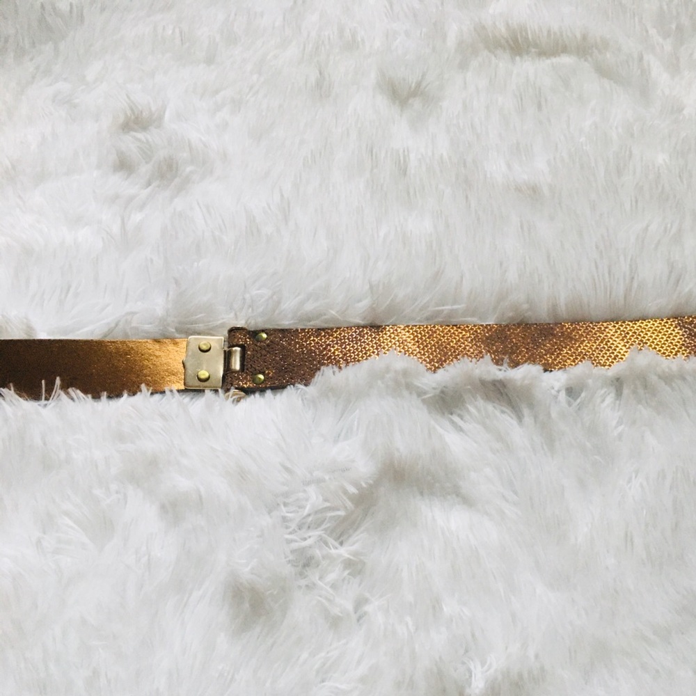 Elie Tahari gold belt.
